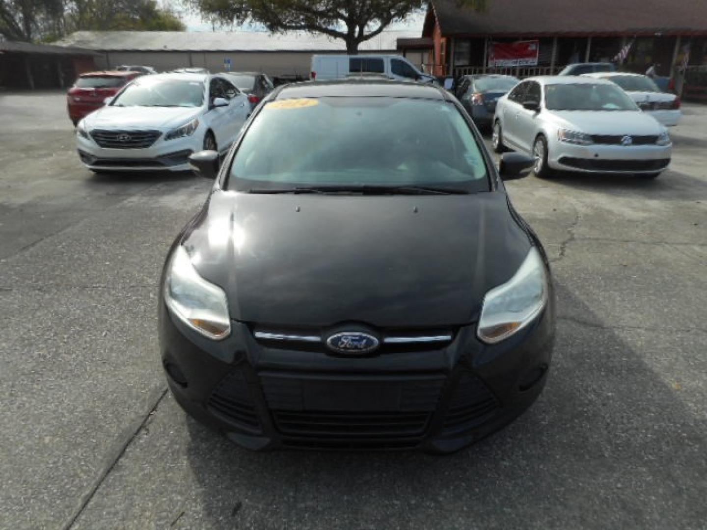 2014 BLACK FORD FOCUS SE (1FADP3K25EL) , located at 10405 Abercorn Street, Savannah, GA, 31419, (912) 921-8965, 31.988262, -81.131760 - Photo#0